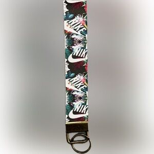 NIKE Wristlet with Bronze colored Keychain NEW Unique